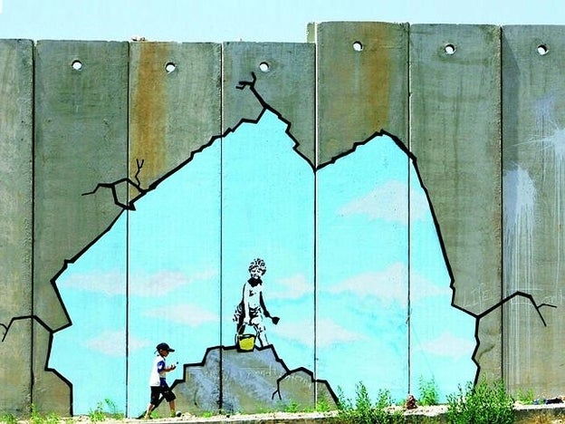 Obras de Banksy, en el muro de la vergüenza de Israel./Cordon