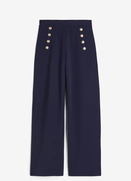 Pantalón ancho en color azul marino con botones dorados de H&M (19,99 euros)