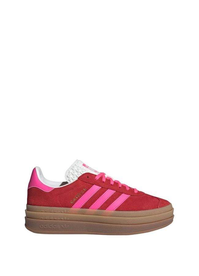 Zapatillas rojas con franjas color rosa de Adidas