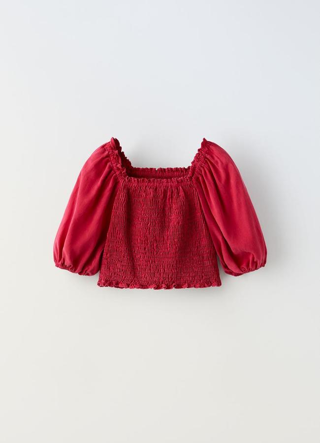 Blusa con fruncido en color fresa de Zara Kids.