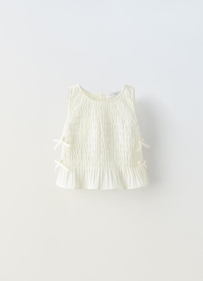 Blusa con lazos laterales de Zara Kids.